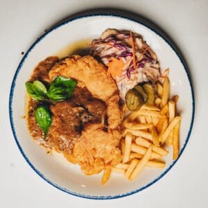 Chicken chop – Asian cuisine Lisbon - Deep-fried chicken with mushroom sauce, sweet corn, and fries