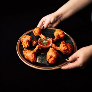 Asian food Lisbon spot - Chicken shaped like lollipops, marinated and fried with a spiced coating