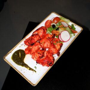 Asian food Lisbon - chicken pieces marinated in yogurt and spices, grilled until tender