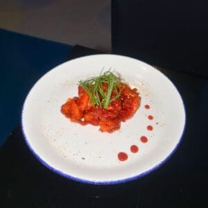 Asian cuisine - Pork or chicken cooked with paprika in a sweet and sour sesame-flavored sauce