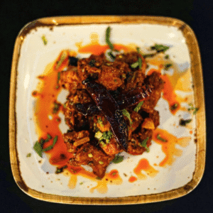 Prato de Choila – comida asiática Lisboa - vegetais ou frango, misturado com mostarda e malagueta